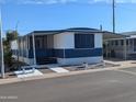 Charming mobile home featuring a screen room and white and blue color scheme at 205 S Higley Rd # 8, Mesa, AZ 85206