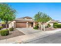 Inviting single-Gathering home with a two-car garage, desert landscaping, and a neatly maintained front yard and walkway at 3220 N 136Th Dr, Avondale, AZ 85392