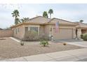 Charming single-story home with a tiled roof, desert landscaping, and an attached two-car garage at 3925 W Hackamore Dr, Phoenix, AZ 85083