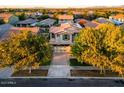Two-story home with desert landscaping and a brick-paved driveway in a residential area at 4084 E Rawhide St, Gilbert, AZ 85296