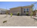Modern home featuring xeriscaping with young trees and a rock groundcover at 4211 E Desert Vista Trl, Cave Creek, AZ 85331