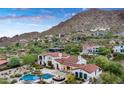 Aerial view of a Mediterranean-style home with a pool and landscaping in the hillside neighborhood at 4743 N 54Th St, Phoenix, AZ 85018