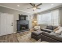 Comfortable living room with a modern fireplace, plush seating, and large windows, perfect for cozy evenings at 7009 E Acoma Dr # 1044, Scottsdale, AZ 85254