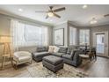 Bright living room featuring a large sectional sofa, stylish decor, and ample natural light, ideal for relaxation at 7009 E Acoma Dr # 1044, Scottsdale, AZ 85254