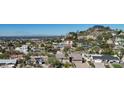 Neighborhood aerial view showcases homes with desert landscaping, and city views at 7607 N 22Nd Pl, Phoenix, AZ 85020