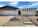 Charming single-story home showcasing a gated entrance, desert landscape, and a well-manicured front yard at 7607 N 22Nd Pl, Phoenix, AZ 85020