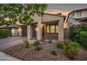 Inviting single-story home with a covered porch and desert landscaping at 10024 E Tamery Ave, Mesa, AZ 85212