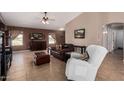 Inviting living room with neutral walls, tile floors, and comfortable seating arrangement at 14822 N Tonya Cir, El Mirage, AZ 85335