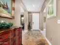 Elegant foyer with tile flooring, neutral wall paint, and tasteful decor for a warm welcome at 15322 W Montecito Ave, Goodyear, AZ 85395