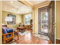 Cozy living room featuring hardwood floors, neutral paint, and comfortable furniture at 20449 N Lemon Drop Dr, Maricopa, AZ 85138