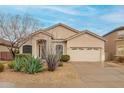 Beautiful single-Gathering home featuring a low-maintenance desert landscape and a two-car garage at 26065 N 68Th Ln, Peoria, AZ 85383