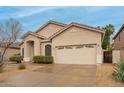 Beautiful single-Gathering home featuring a low-maintenance desert landscape and a two-car garage at 26065 N 68Th Ln, Peoria, AZ 85383