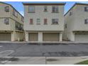 Townhouse with a two-car garage, neutral stucco, and well-maintained landscaping at 2746 S Harmony Ave, Gilbert, AZ 85295