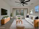 Bright living room with modern furnishings and a sliding glass door to the balcony at 2746 S Harmony Ave, Gilbert, AZ 85295