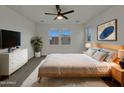 Stylishly furnished main bedroom featuring a light wood bed frame and contemporary accents at 2746 S Harmony Ave, Gilbert, AZ 85295