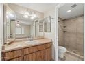 Bright bathroom featuring a vanity with double mirrors and a walk-in shower at 3129 W Mohawk Ln, Phoenix, AZ 85027