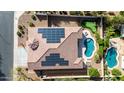 Bird's eye view of a house featuring solar panels, a pool, and a putting green in the backyard at 4102 E Crescent Way, Chandler, AZ 85249