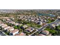 An aerial view of a vibrant neighborhood surrounded by lush greenery and peaceful lakes at 4102 E Crescent Way, Chandler, AZ 85249