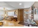 Cozy living room featuring laminate flooring, a ceiling fan, and a welcoming atmosphere at 5255 W Caribbean Ln, Glendale, AZ 85306