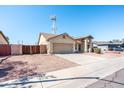 Charming one-story home with desert landscaping and an attached two-car garage at 8818 N 110Th Ave, Peoria, AZ 85345