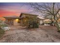 Desert property featuring stone veneer, desert landscaping, and mature trees at 9331 E Mclellan Rd, Mesa, AZ 85207