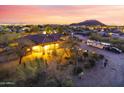 Desert property featuring a spacious lot, mature trees, and RV parking for convenient travel accommodations at 9331 E Mclellan Rd, Mesa, AZ 85207