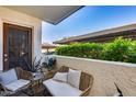 Cozy balcony with stylish seating, providing a relaxing outdoor space and neighborhood views at 11011 N 92Nd St # 1157, Scottsdale, AZ 85260