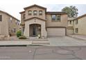 Charming two-story home with a covered entrance, attached two-car garage, and well-maintained landscaping at 17062 N 184Th Dr, Surprise, AZ 85374