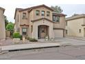 Attractive two-story house with an attached garage, covered entryway, and desert-friendly landscaping at 17062 N 184Th Dr, Surprise, AZ 85374
