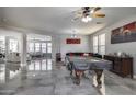 Spacious living room features a pool table, modern decor, and glossy tile flooring for a contemporary look at 17916 N 183Rd Ave, Surprise, AZ 85374