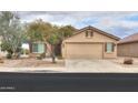 Charming home featuring desert landscaping, a two-car garage, and a neutral-colored exterior at 188 N Nueva Ln, Casa Grande, AZ 85194