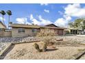 Front yard with rock landscaping and a desert xeriscape, including saguaro cacti at 2123 E Radcliffe Dr, Tempe, AZ 85283