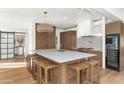 Stylish kitchen featuring a large island with seating and modern appliances at 37 Spur Cir, Scottsdale, AZ 85251