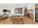 Bright and spacious kitchen with a large island and an adjacent dining area at 37 Spur Cir, Scottsdale, AZ 85251