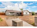Charming single-story home with a landscaped yard and a circular driveway at 4031 N 81St Ave, Phoenix, AZ 85033