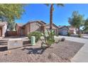 Inviting single-Gathering home featuring desert landscaping and an attached two-car garage at 43409 W Sagebrush Trl, Maricopa, AZ 85138