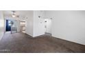 View of the living room, kitchen, and laundry area that offers convenience at 461 W Holmes Ave # 383, Mesa, AZ 85210