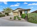 Attractive home featuring neat landscaping, a brick driveway, and a convenient two-car garage at 7769 S Reseda St, Gilbert, AZ 85298