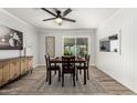Dining room with modern decor, a ceiling fan, and large windows providing lots of natural light at 8345 E Oak St, Scottsdale, AZ 85257