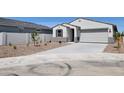 Attractive single-story home featuring a two-car garage and low-maintenance landscaping at 8530 W Trenton Ct, Florence, AZ 85132
