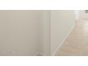 Hallway with tile flooring, neutral colored walls, and white trim at 8576 W Trenton Ct, Florence, AZ 85132