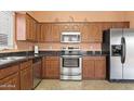 Updated kitchen featuring stainless steel appliances and sleek countertops at 14527 W Marcus Dr, Surprise, AZ 85374