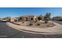 Charming single-story home with drought-tolerant landscaping, circular driveway, and neutral paint scheme at 14717 N 130Th Ln, El Mirage, AZ 85335