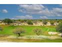 Picturesque golf course view showcases golfers enjoying the sunny day on well-maintained green at 15802 N 71St St # 501, Scottsdale, AZ 85254