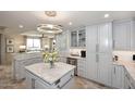 Bright kitchen featuring stone countertops, stainless steel appliances, and tile backsplash at 15802 N 71St St # 501, Scottsdale, AZ 85254