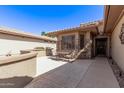 A cozy outdoor patio area offers a peaceful retreat, perfect for relaxing or entertaining guests at 18665 N Patina Ct, Surprise, AZ 85387