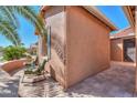 Cozy side patio with comfortable seating, offering a private outdoor space with pavers at 19 N Agua Fria Ln, Casa Grande, AZ 85194