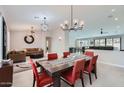 Bright dining room with stylish lighting, modern furniture, and tile floors at 22181 N 78Th St, Scottsdale, AZ 85255