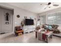 Comfortable living room featuring a cozy seating area, a TV, and neutral-toned walls at 22452 E Calle De Flores --, Queen Creek, AZ 85142
