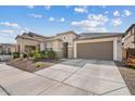 A charming single-story home features a well-manicured yard, neutral tones, and an attached two-car garage at 23103 E Mewes Rd, Queen Creek, AZ 85142